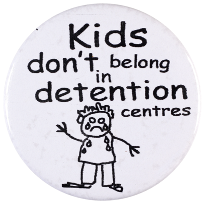 This badge was produced as part of a campaign against the government policy of detaining children in mandatory immigration detention centres.