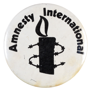 This badge was produced by Amnesty International, a worldwide movement formed in 1961 to campaign to protect human rights.