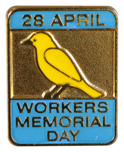 This badge was produced to commemorate International Workers Memorial Day, a remembrance day for workers killed, injured or made sick by their work.