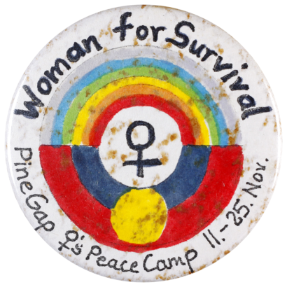 This badge celebrates the Pine Gap Women’s Peace Camp held in November 1983 at Pine Gap, a satellite tracking station near Alice Springs. The camp was attended by over 800 women who demonstrated against the presence of a United States base in Australia.